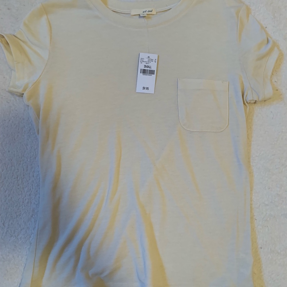 Cream T-Shirt with cute pocket.